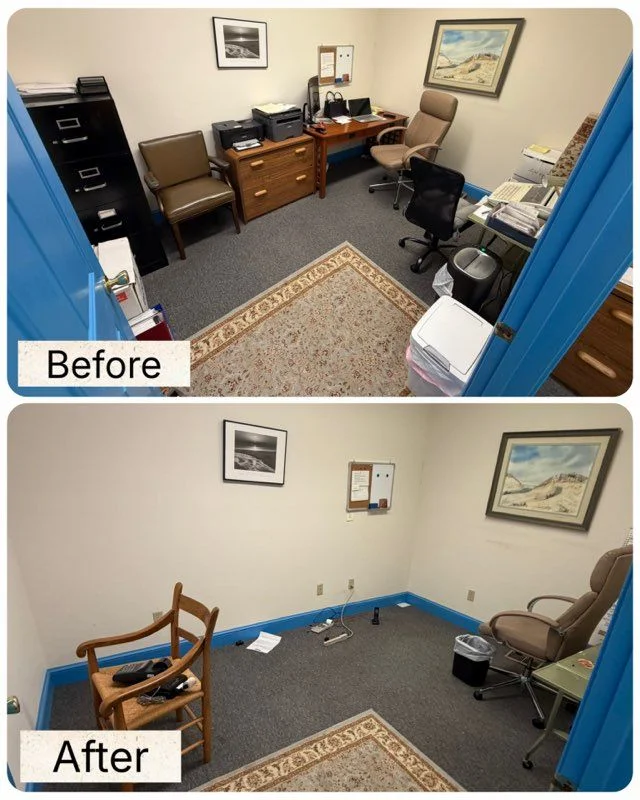 A cleared commercial office space in Fredericksburg, VA after junk removal, with empty floors and no remaining debris. Anderson Removal LLC truck visible in the background outside the building entrance.